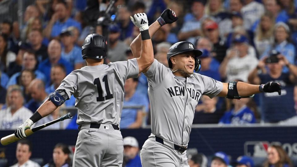 October 9, 2024; Kansas City, Missouri, United States; New York Yankees designated hitter Giancarlo Stanton (27) celebrates with New York Yankees third baseman Jazz Chisholm Jr. (13) after hitting a home run in the eighth inning against the Kansas City Royals during the third game of the NLDS for the 2024 MLB Playoffs. at Kauffman Stadium. Mandatory Credit: Peter Aiken-Imagn Images