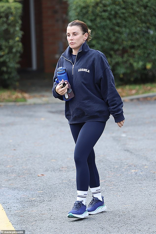 Coleen cut a casual figure as she changed into navy sportswear and donned a zip-up jumper which she teamed with sports leggings and matching trainers.