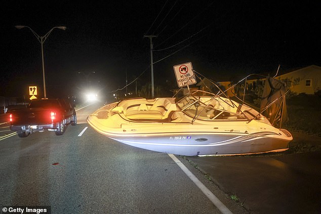 A boat rests on a road in Port Charlotte, Florida, on Thursday after Hurricane Milton made landfall.