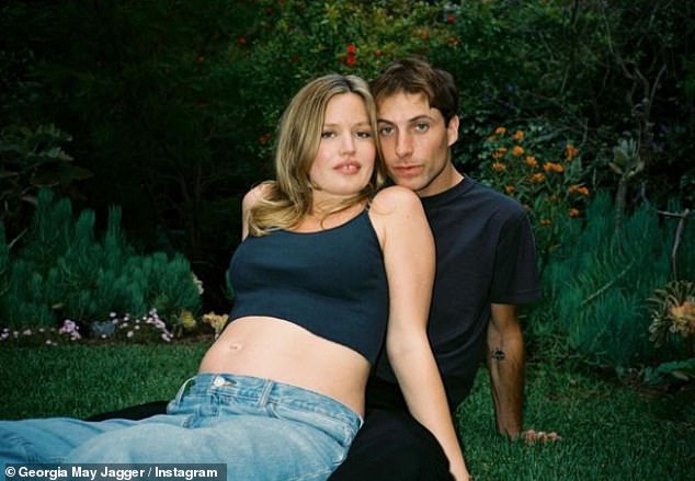 The model, 32, looked every inch the doting mother in her first photo with the newborn, who she shares with her skater boyfriend Cambryan Sedlick, 24.