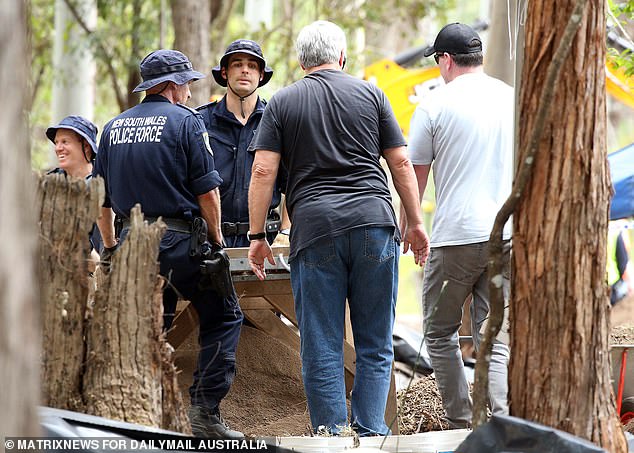 Current Strike Force Commander, Detective Chief Inspector David Laidlaw (grey shirt, centre) with police officers at the William Tyrrell excavation site on Batar Creek Road, Kendall in 2021