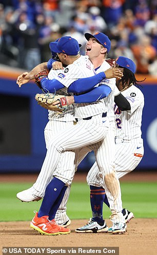 New York Mets players celebrate Wednesday's series-clinching victory over the rival Phillies.