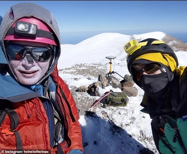 Eric Gilbertson (left) hiked Mount Rainier in August and September and used a GPS surveying unit to determine the mountain's elevation.