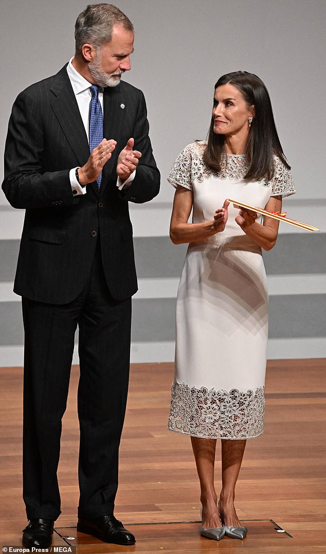 King Felipe (pictured, left) was photographed smiling at his wife, Queen Letizia (pictured, right) during the presentation in Madrid.