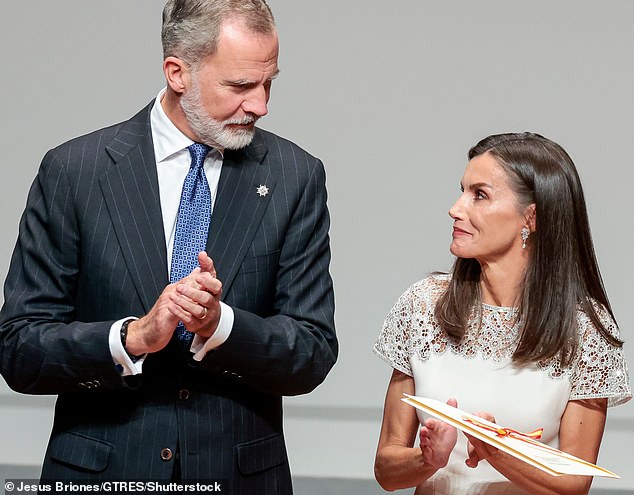 The evening appeared to be a joyous one for the Spanish royal couple (pictured), who seemed happy to be together as they smiled widely at each other.