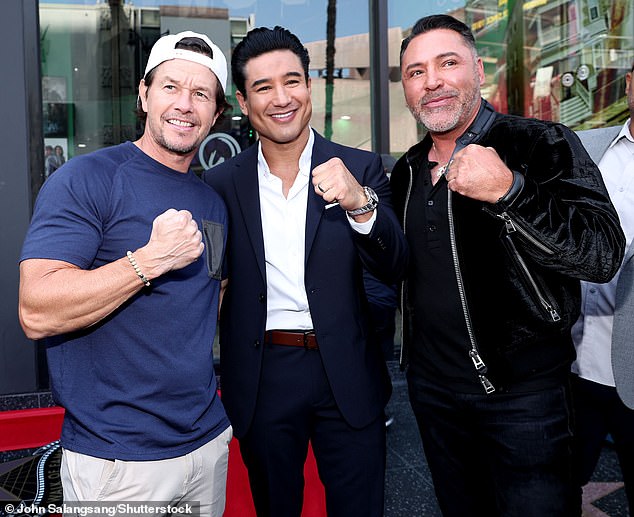 Boxing legend Oscar De La Hoya joined the celebration and shared a laugh with Mario and Mark.