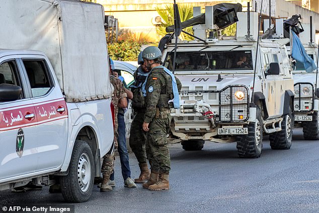 Spanish peacekeepers from the United Nations Interim Force in Lebanon (UNIFIL) coordinate their patrol with the Lebanese Military Police, in Marjayoun, southern Lebanon, on October 8, 2024.