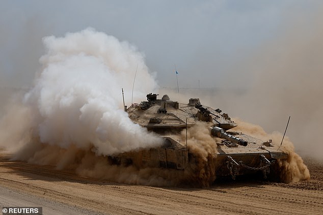 An Israeli tank maneuvers near the Israel-Gaza border, amid the ongoing conflict between Israel and Hamas, in southern Israel, on October 6, 2024.