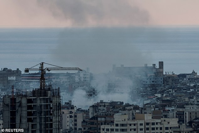 Smoke rises over Dahiyeh in the southern suburbs of Beirut following Israeli airstrikes, amid ongoing hostilities between Hezbollah and Israeli forces, as seen from Sin El Fil, Lebanon, October 10, 2024.