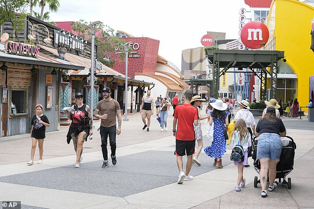 Visitors walking through Disney World before it closed to prepare for Hurricane Milton