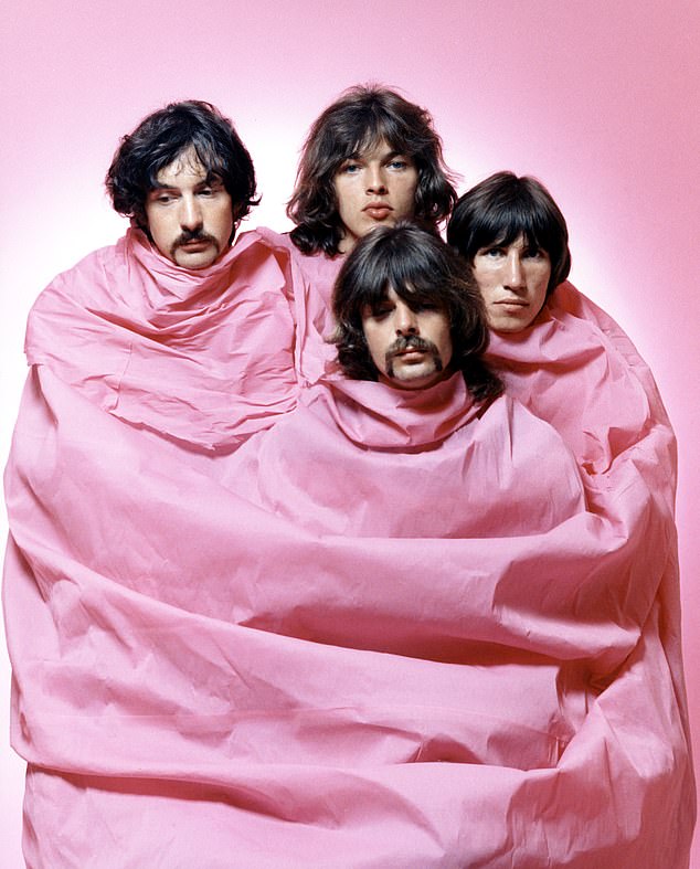 Psychedelic rock group Pink Floyd poses for a portrait wrapped in pink in August 1968 in Los Angeles. (L to R) Nick Mason, Dave Gilmour, Rick Wright (center front), Roger Waters.