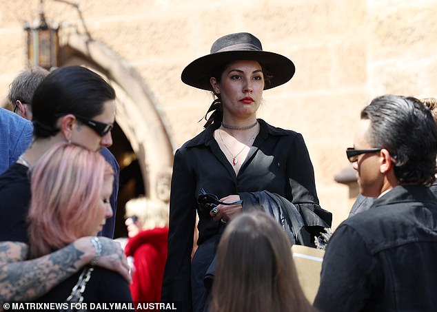 One of hundreds of mourners in front of St. Mark's Church.