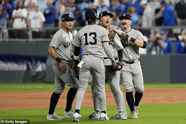 The Yankees celebrate after beating the Royals on Thursday night at Kauffman Stadium.