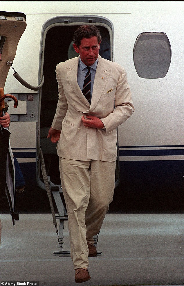 Charles gets off a plane to continue his tour of Australia and New Zealand