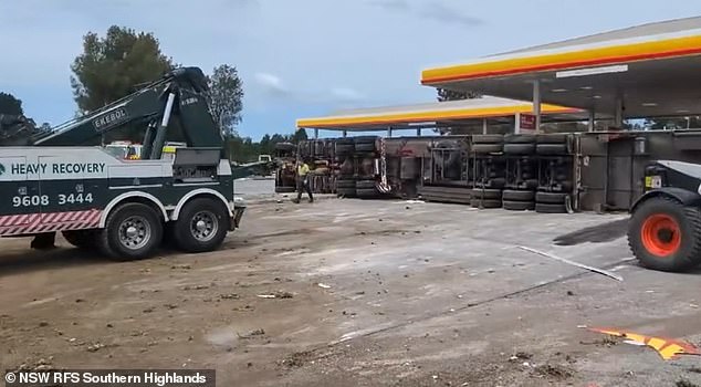 A heavy recovery truck prepares to go to work at the rollover site (pictured)