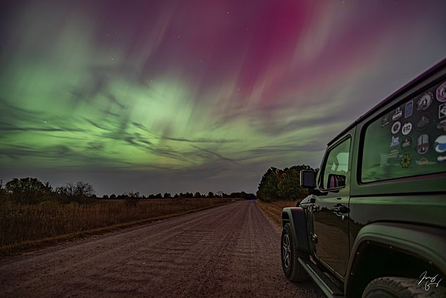 A shade of purple and green light curtains was captured in Zimmerman, Minnesota.