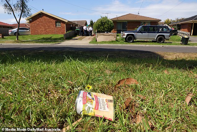 Ross Street property is littered with trash and has several broken windows