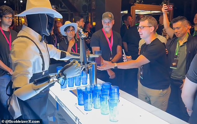 Guests at the event were surprised by the robot bartender's ability to serve and pour drinks.