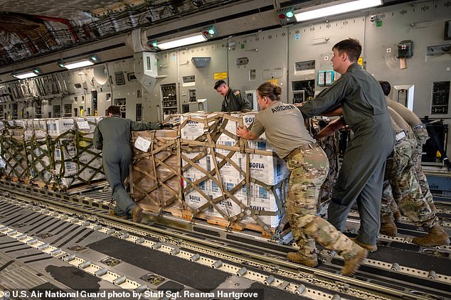 Members of the North Carolina Air National Guard place a hurricane relief platform on a C-17 Globemaster III for delivery in western North Carolina.