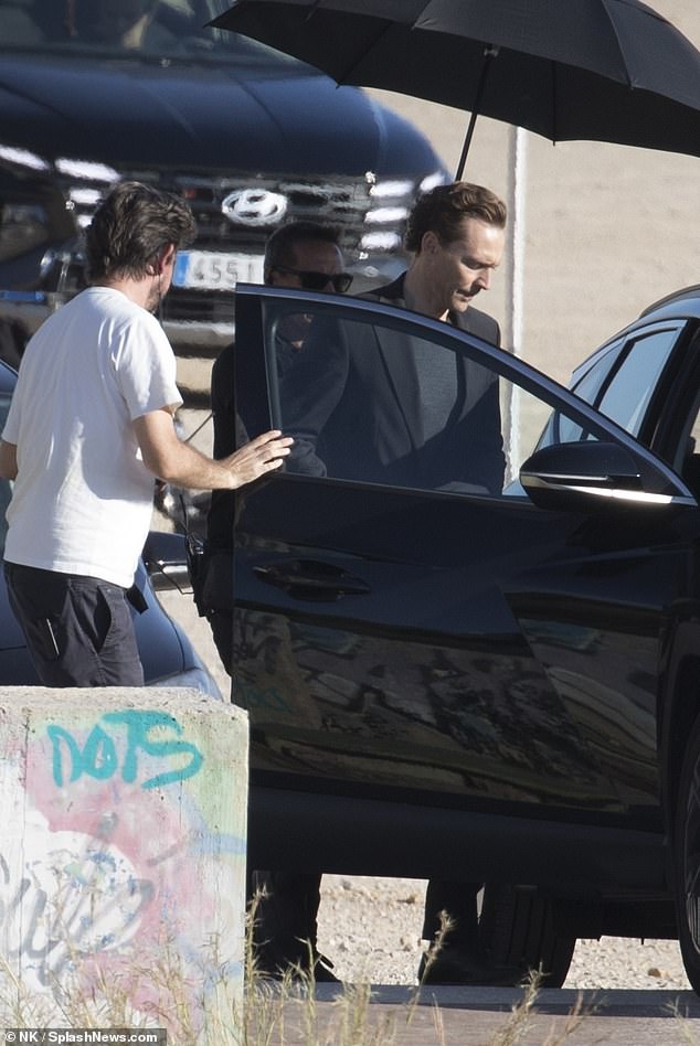 Tom was then seen getting into a car while a crew member helped him with the door.