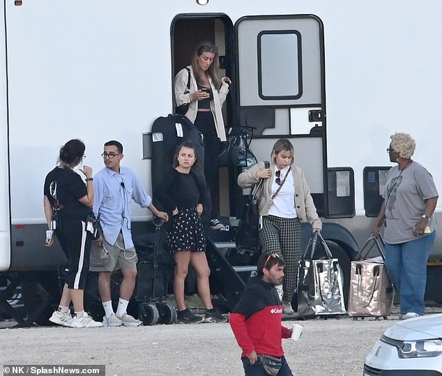 The rest of the team was seen chatting outside Tom's trailer.