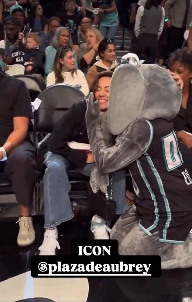 Aubrey was in a good mood when the Liberty mascot approached her.