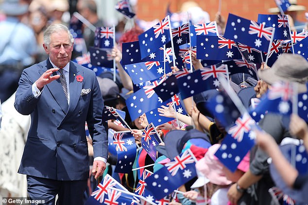 The King is greeted by schoolchildren during a visit to Kilkenny Primary School on November 7, 2012 in Adelaide.