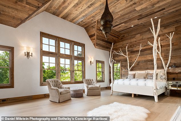 A fabulous wooden ceiling rises high above the bedroom.