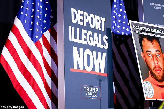 Signs are on stage before Republican presidential candidate former US President Donald Trump speaks at a rally at the Gaylord Rockies Resort and Convention Center on October 11, 2024 in Aurora, Colorado. Trump campaigns in key states ahead of Nov. 5 presidential election