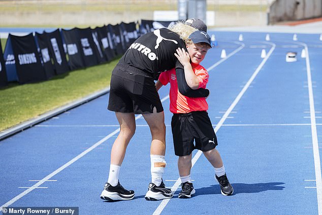 Marathon runner Brockmann found out about Hugo's situation and invited the young man to run a lap with him on the Sydney Athletic Center track.