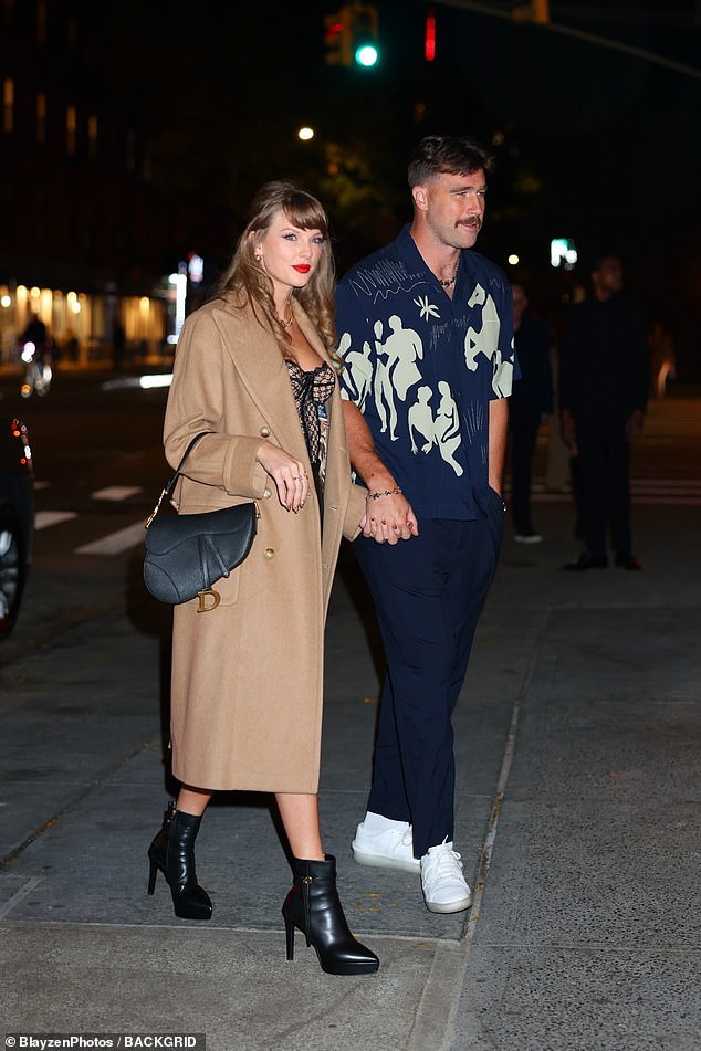 Taylor and Travis didn't look bothered as they packed on the PDA as they strutted hand-in-hand into the hotspot after their Swifties trashed their ex Kayla Nicole for her recent tell-all interview.