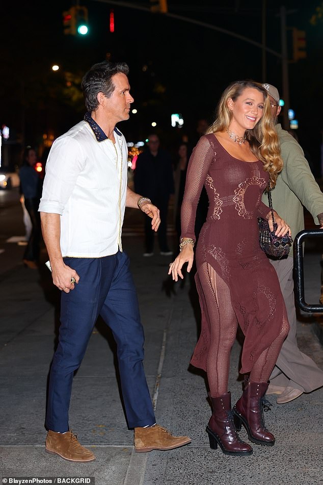 Blake, 37, looked absolutely stunning in a completely sheer burgundy dress which consisted of a skin-tight dress over stockings and matching leather ankle boots.