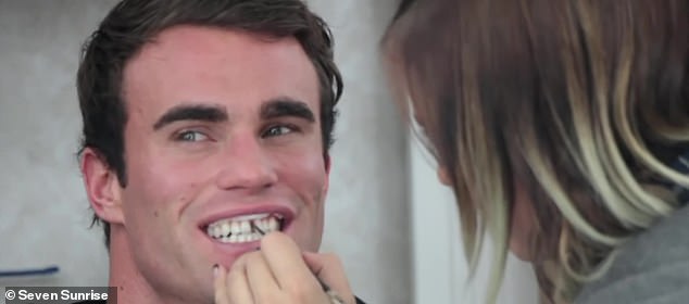 Van Moger puts on makeup with false teeth to look like a young Arnold Schwarzenegger