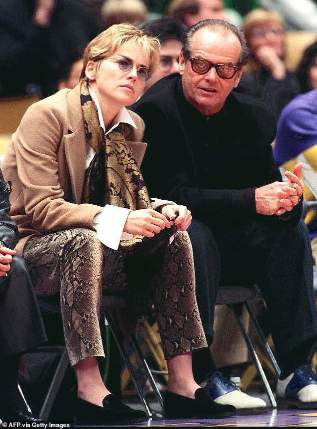 Sharon Stone and Jack Nicholson attend a Lakers-Nuggets game in the 90s