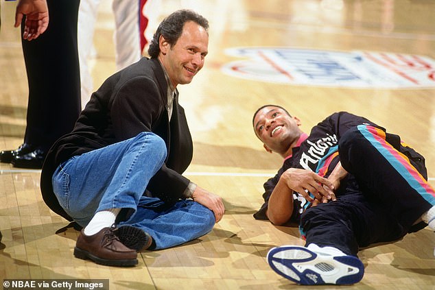 Billy Crystal talks to his friend and former Clippers guard Doc Rivers in 1995