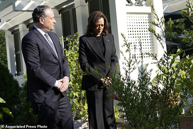 Harris, right, and second gentleman Doug Emhoff stand after planting a memorial tree on the grounds of the vice president's residence in Washington on Monday.