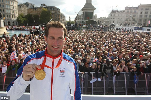 Ainslie photographed with one of his Olympic gold medals in London's Trafalgar Square in 2008.