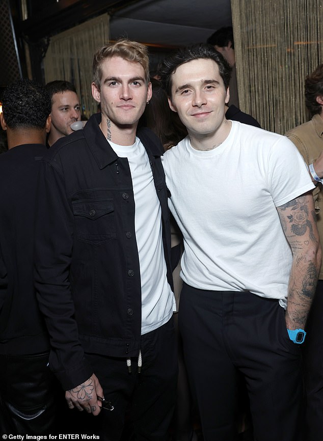 Brooklyn and Presley smiled as they posed for a photo together at the launch party.