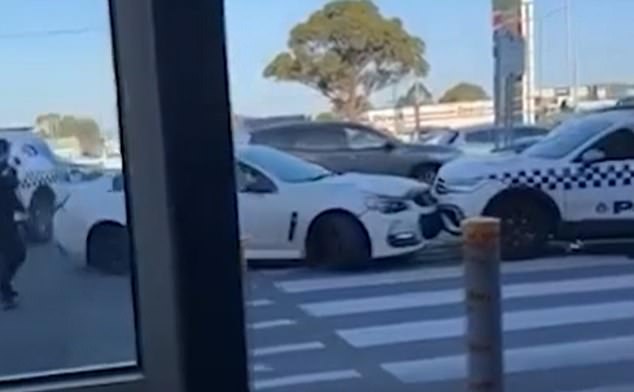 Bystanders filmed the frantic escape in which the man rammed two police vehicles before escaping in Melbourne's Campbellfield Plaza.