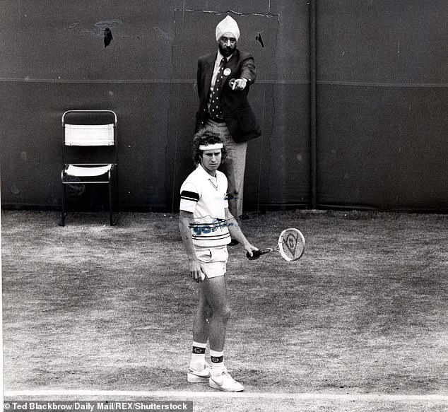 Linesman Raghbir Singh Mhajan, back, says the decision to replace the electronic monitors at Wimbledon will ruin the 147-year-old tournament.