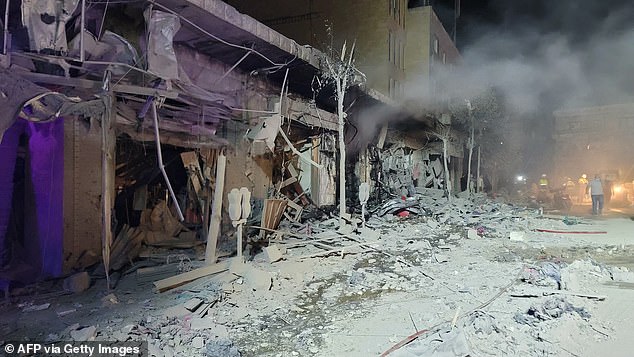 A rescuer searches for survivors in the city of Nabatiye, southern Lebanon.