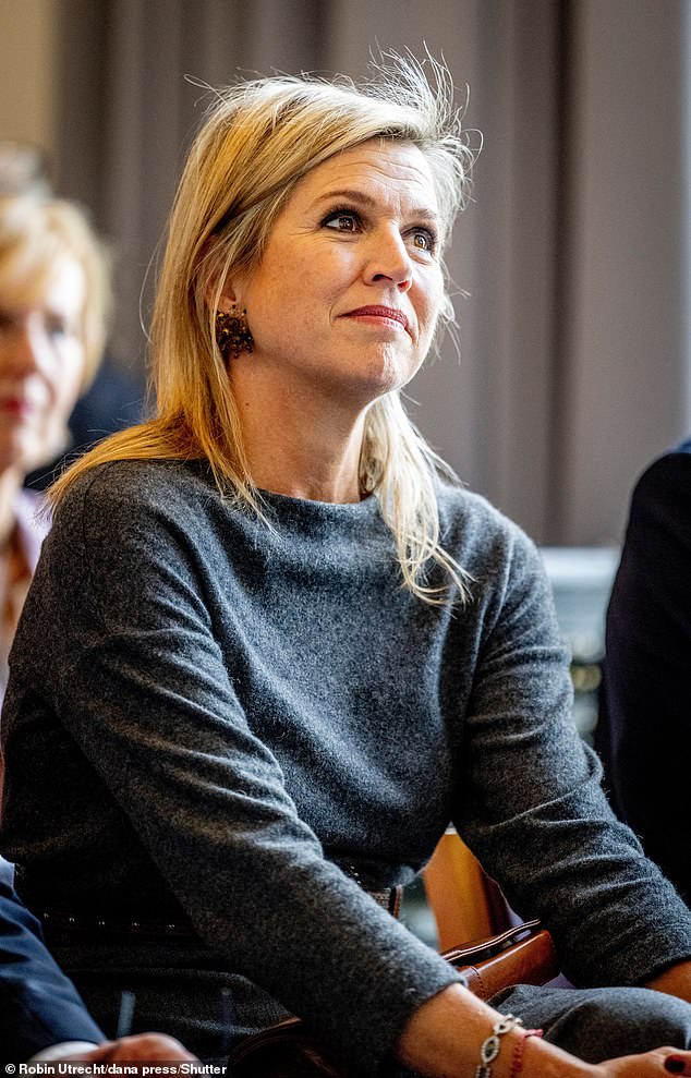 The Dutch queen, 53, with a background in finance, seemed focused and engaged at the meeting organized by SchuldenlabNL.