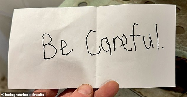 A threatening note (pictured) was stuffed under the bakery's door overnight