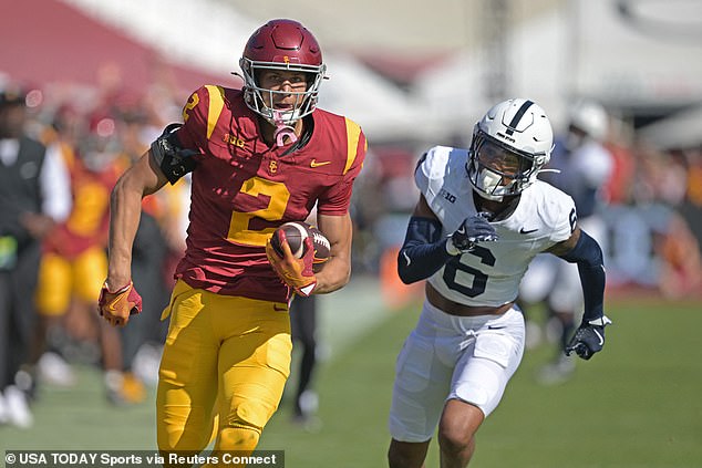 USC Trojans wide receiver Duce Robinson (2) runs the ball after a completion before it is stopped by Penn State Nittany Lions safety Zakee Wheatley (6).