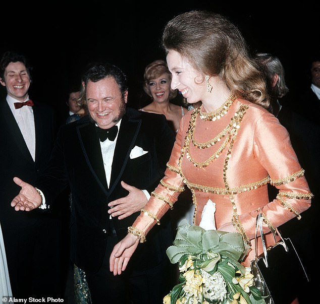 The royal, with her hair pulled back and down in loose curls, at the London Palladium in 1971.