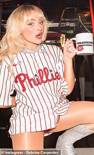 Sabrina Carpenter wearing a Phillies jersey