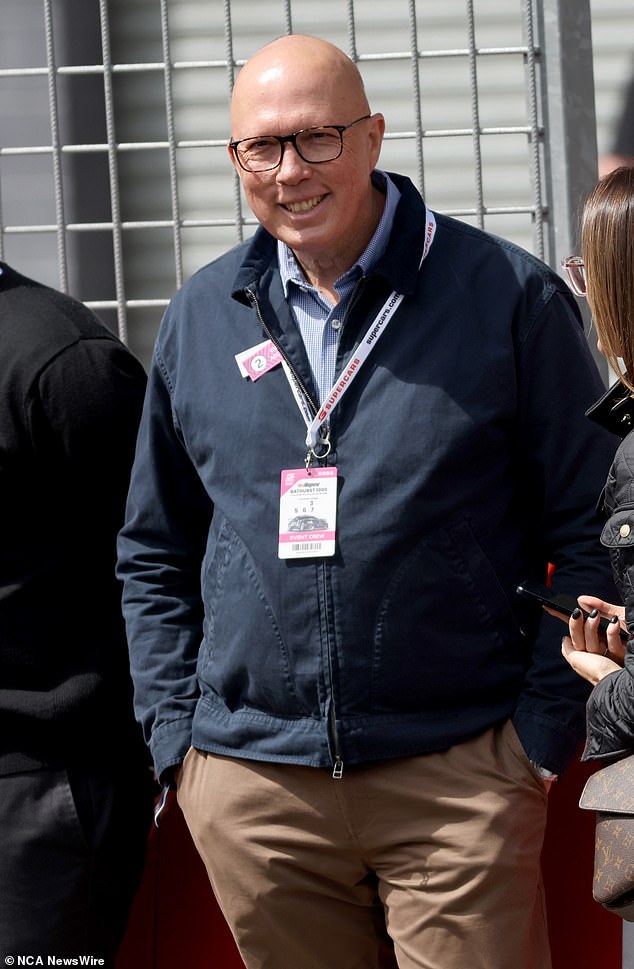 It is the first time the Coalition has taken the lead in the polls since losing the 2022 election. However, its leader, Peter Dutton (pictured at Bathurst 1000 on Sunday), remains behind Albanese as the 