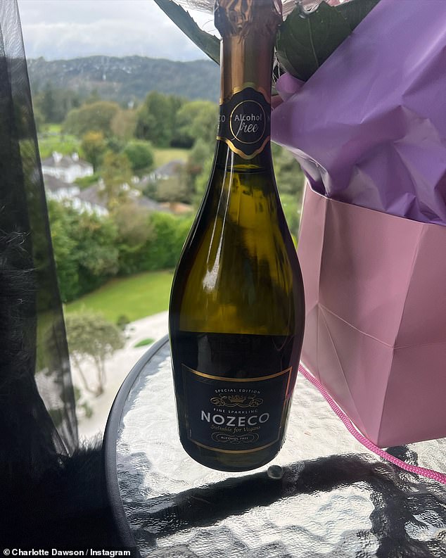 Announcing that 'bad life' had tried to ruin her birthday getaway, Charlotte shared a photo of a bottle of non-alcoholic Nozeco that she was drinking.