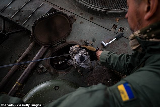 Ukrainian servicemen of the 33rd Brigade maintain their Leopard 2A4