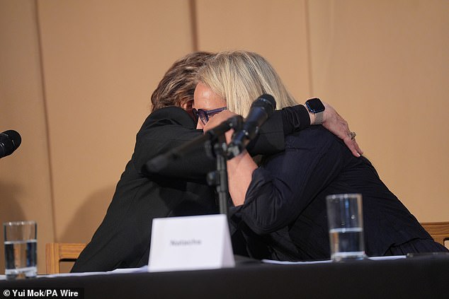 Natacha is hugged by US Attorney Gloria Allred after speaking during a press conference to discuss her involvement in the investigation.